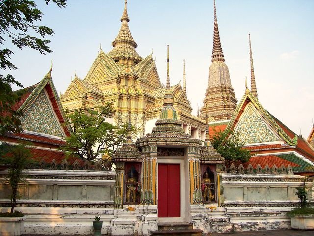Golden chedis and ornate roofs of Wat Pho in Bangkok
